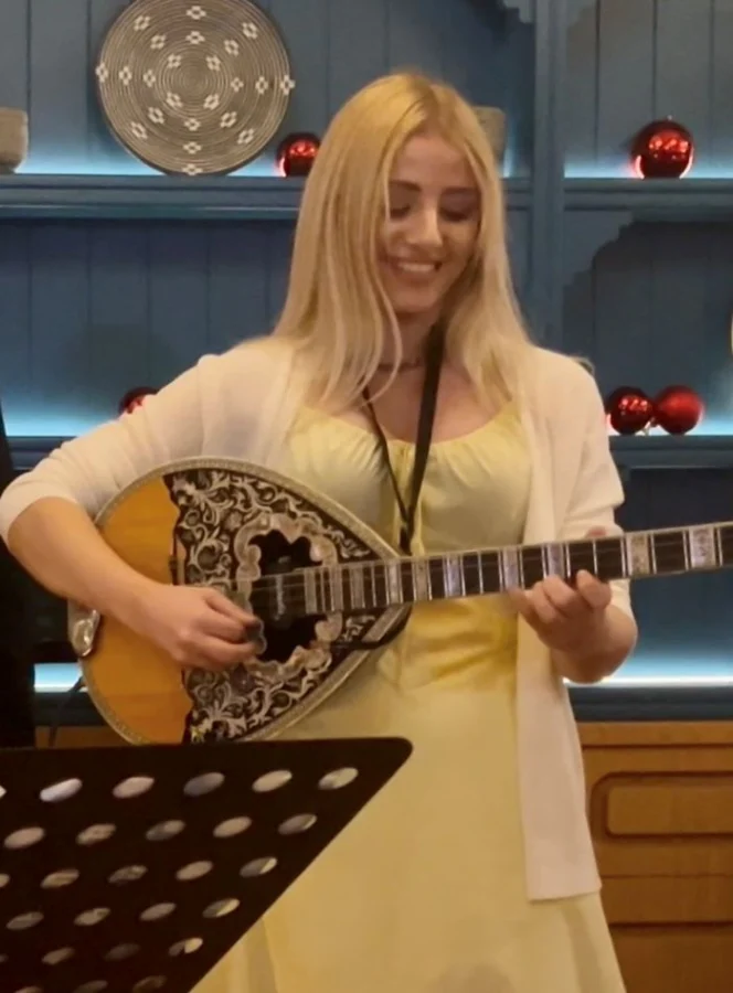 kaela-artist-playing-bouzouki-traditional-greek-music-education